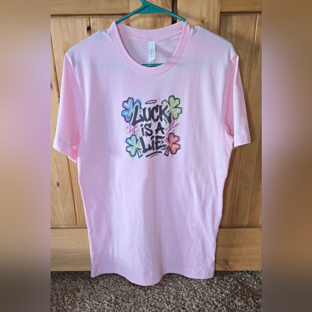 Brand new pink Bella Canvas T-shirt, "Luck Is A Lie" Sz. Medium
